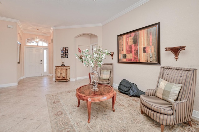 entrance foyer with ornamental molding and light tile patterned flooring