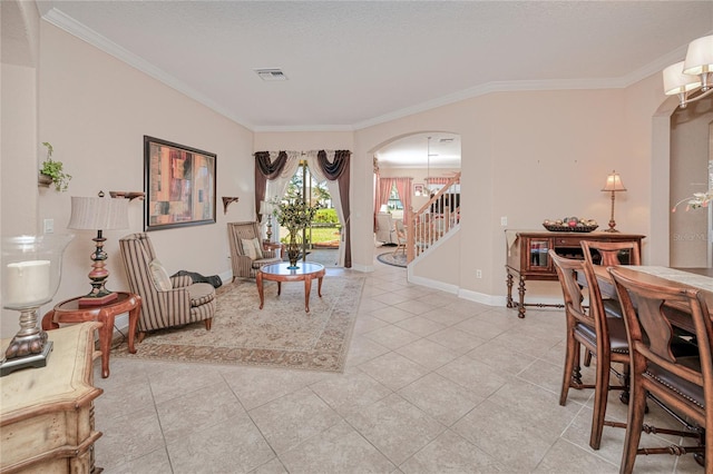 interior space with light tile patterned flooring, crown molding, and a chandelier