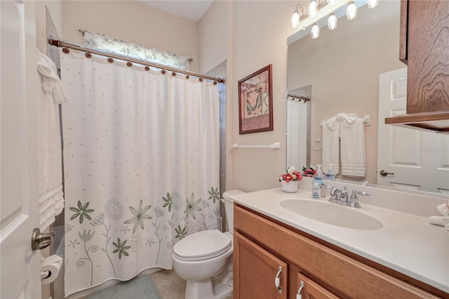 bathroom with tile patterned flooring, vanity, curtained shower, and toilet