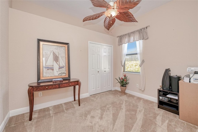 misc room featuring light carpet and ceiling fan