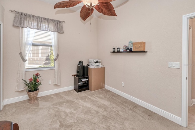 unfurnished office with ceiling fan and light colored carpet