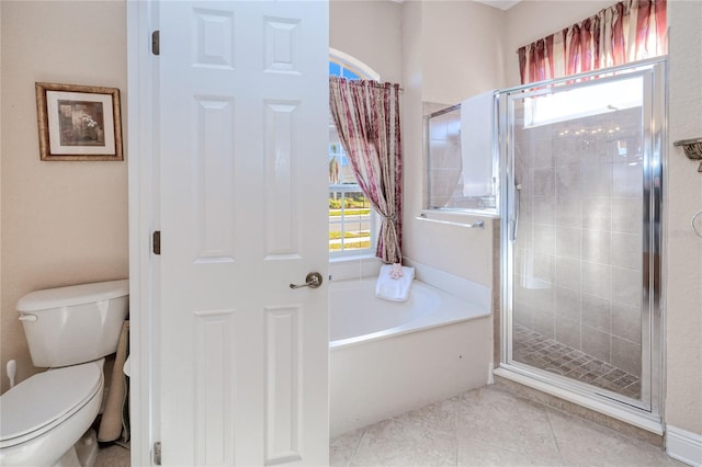 bathroom featuring tile patterned flooring, plus walk in shower, and toilet