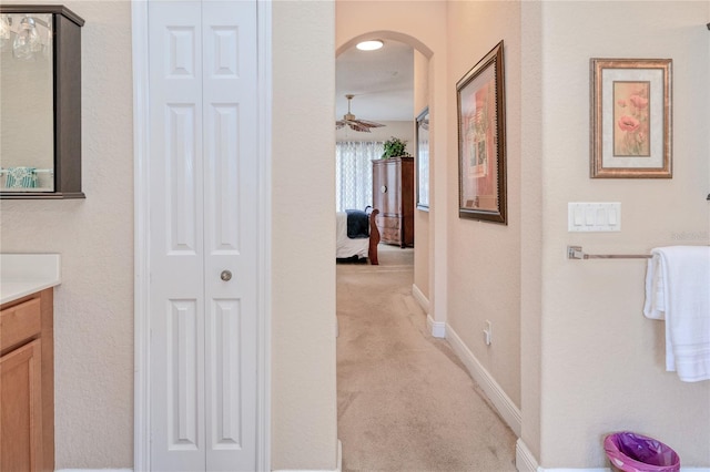 bathroom featuring ceiling fan and vanity