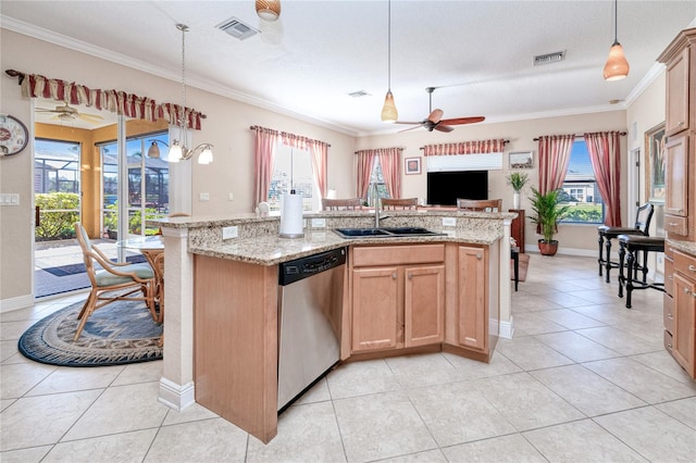 kitchen with a wealth of natural light, a kitchen island with sink, and dishwasher