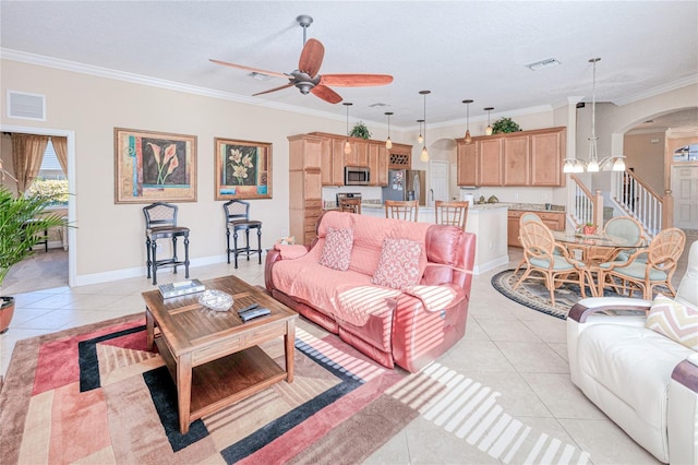 tiled living room with a textured ceiling, ceiling fan, and crown molding