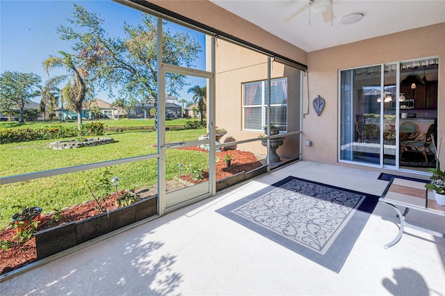 sunroom / solarium with ceiling fan