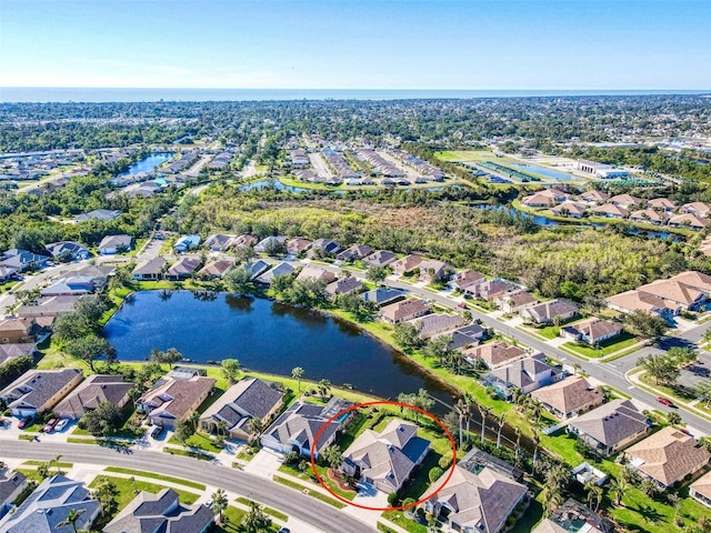 birds eye view of property featuring a water view