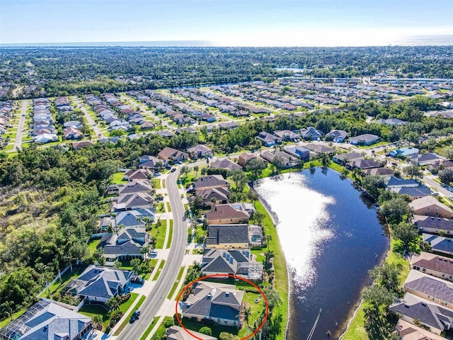 birds eye view of property with a water view