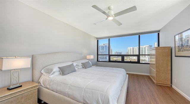 bedroom featuring wood-type flooring and ceiling fan