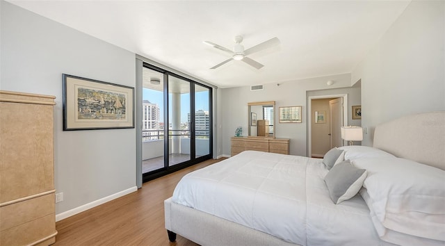 bedroom with access to exterior, hardwood / wood-style floors, and ceiling fan