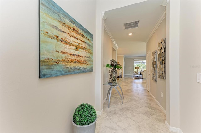 hallway featuring light tile patterned flooring and crown molding