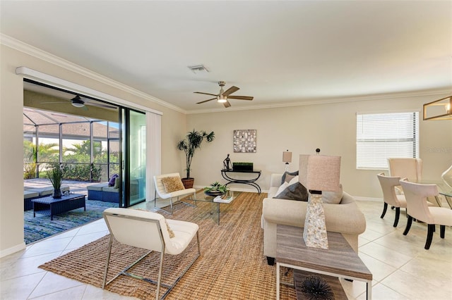 tiled living room featuring crown molding, ceiling fan, and a healthy amount of sunlight