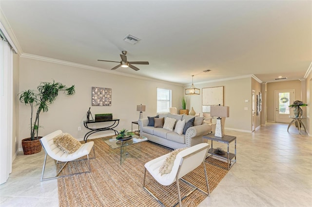 living room featuring ceiling fan, light tile patterned floors, a healthy amount of sunlight, and ornamental molding