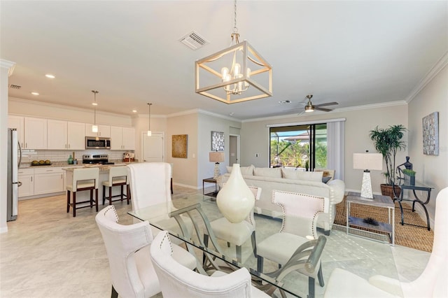 dining room featuring light tile patterned floors, ceiling fan with notable chandelier, and crown molding