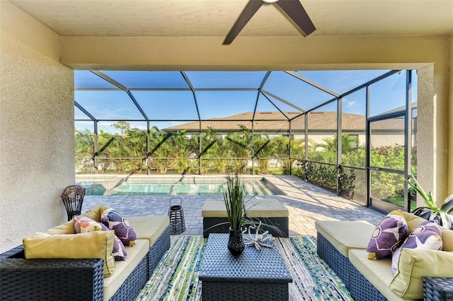 view of patio / terrace with outdoor lounge area, ceiling fan, and a lanai