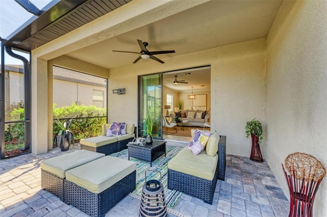 view of patio / terrace with an outdoor living space and ceiling fan