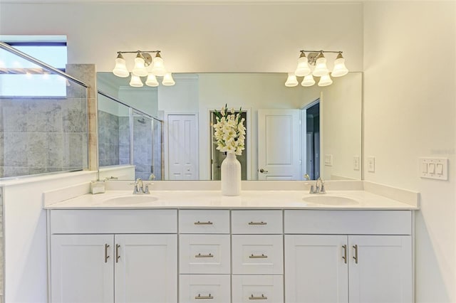 bathroom featuring vanity and an enclosed shower