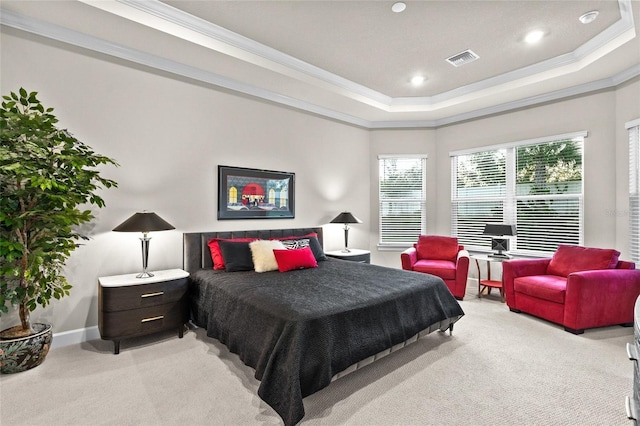 bedroom featuring light carpet, a raised ceiling, and ornamental molding