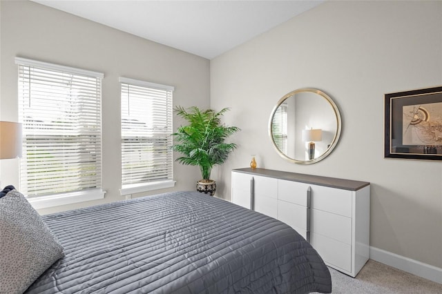 bedroom with light colored carpet