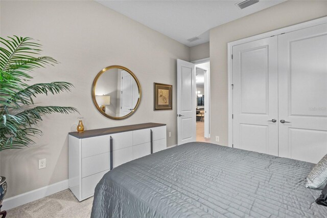 carpeted bedroom featuring a closet