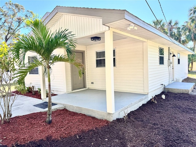 view of side of property with a patio area