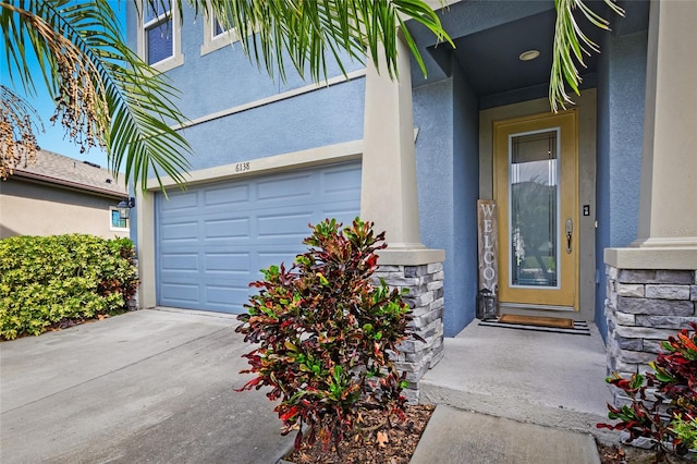 doorway to property featuring a garage