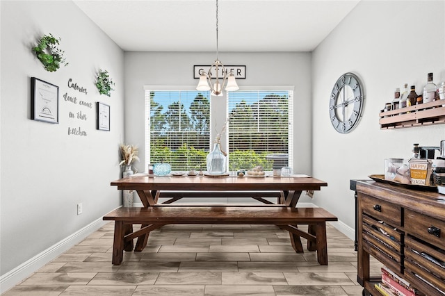 dining space featuring a notable chandelier and light hardwood / wood-style flooring