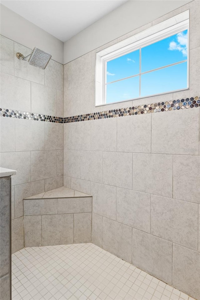 bathroom with a tile shower