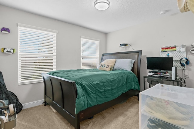 carpeted bedroom with a textured ceiling