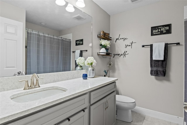 bathroom featuring a shower with curtain, tile patterned flooring, vanity, and toilet