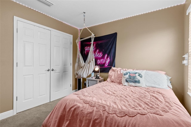 bedroom with a closet and carpet floors