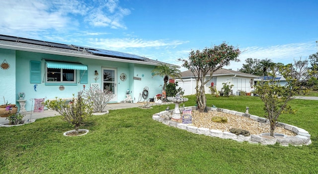 ranch-style home featuring solar panels and a front lawn