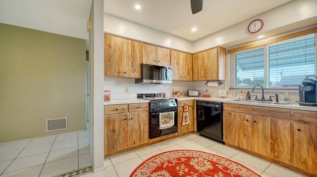 kitchen featuring light tile patterned flooring, sink, ceiling fan, and black appliances