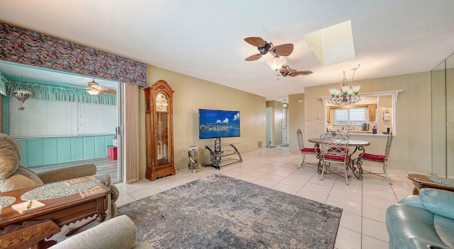 tiled living room with a notable chandelier and a skylight