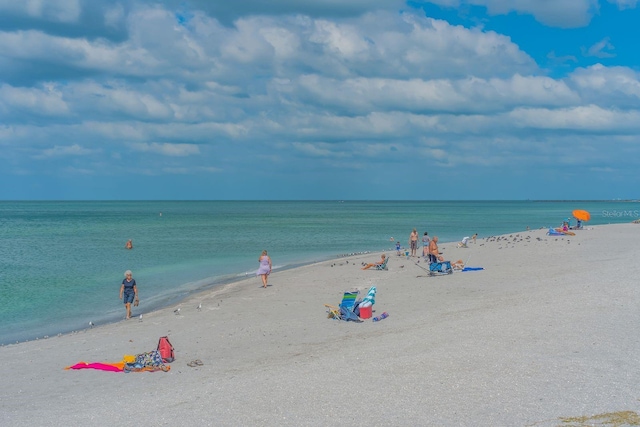 property view of water featuring a beach view