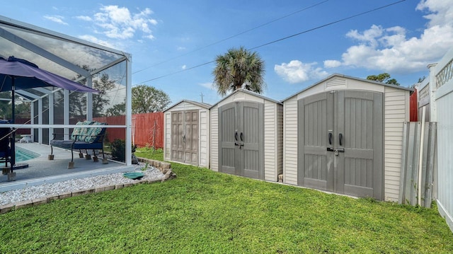 view of yard featuring a storage unit and a lanai