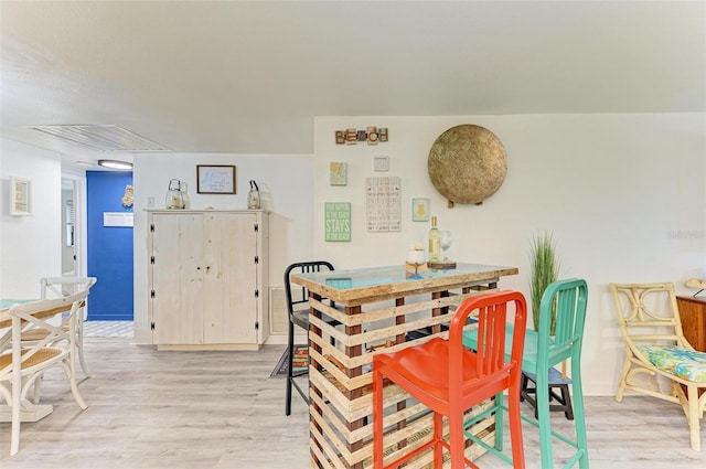 dining room with light hardwood / wood-style flooring