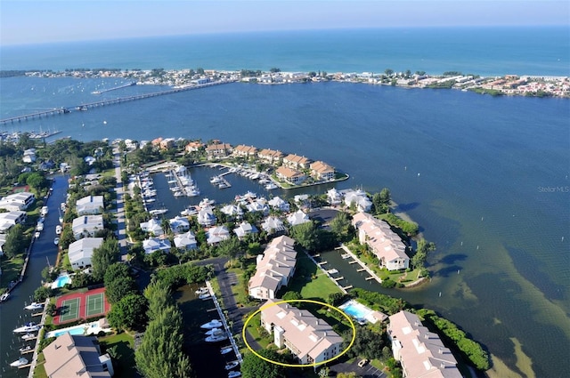 birds eye view of property with a water view