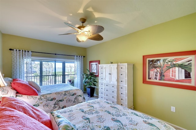 bedroom with access to exterior and ceiling fan