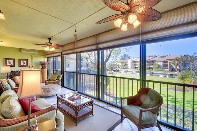 sunroom featuring a healthy amount of sunlight and an AC wall unit