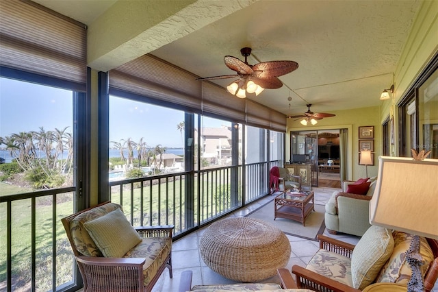 sunroom featuring ceiling fan