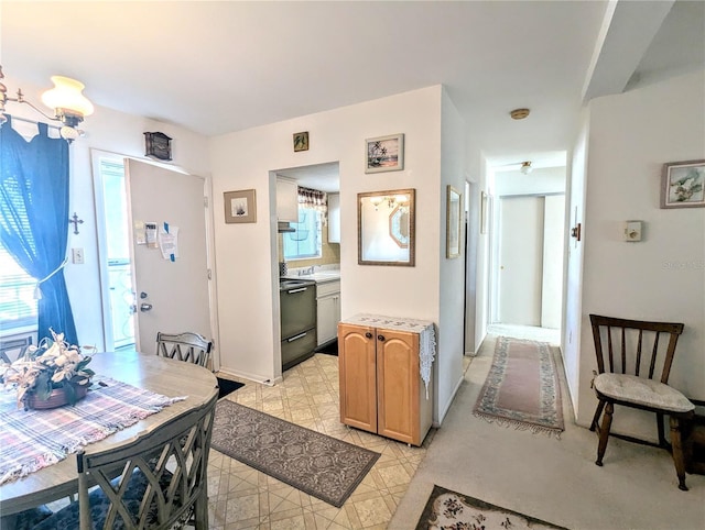 2228 Canal Dr Unit D26, Bradenton, FL 34207 - kitchen featuring dishwasher, light countertops, and light brown cabinets