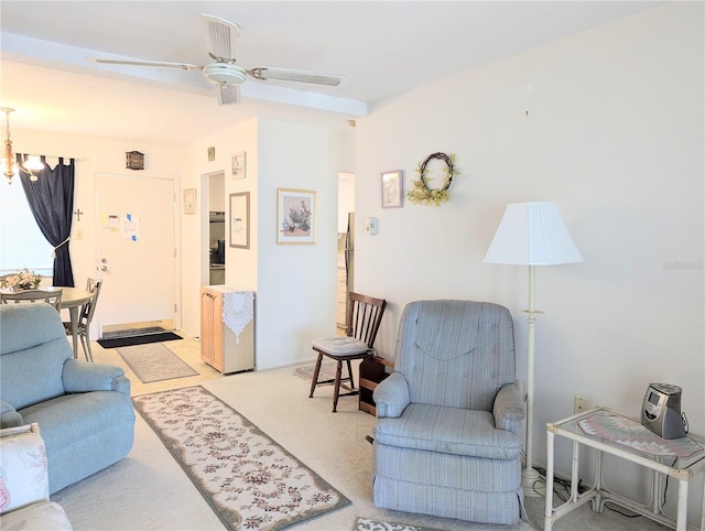2228 Canal Dr Unit D26, Bradenton, FL 34207 - living room with ceiling fan, a chandelier, and light carpet