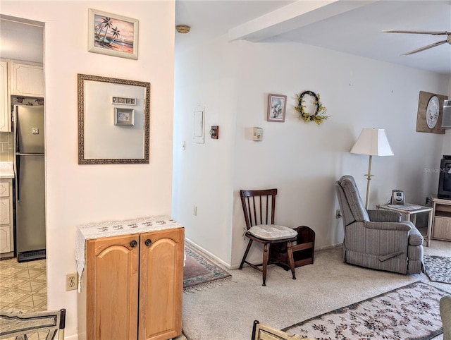 living room with light colored carpet and ceiling fan