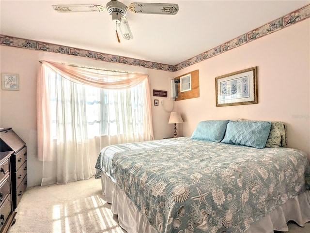 2228 Canal Dr Unit D26, Bradenton, FL 34207 - bedroom with light colored carpet, ceiling fan, and an AC wall unit