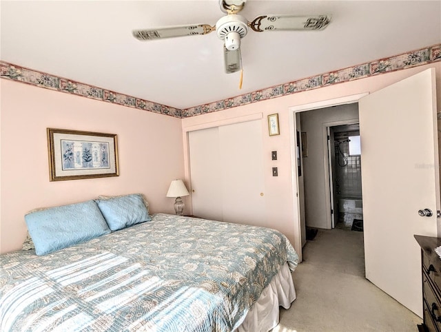 bedroom with ceiling fan, a closet, and light carpet