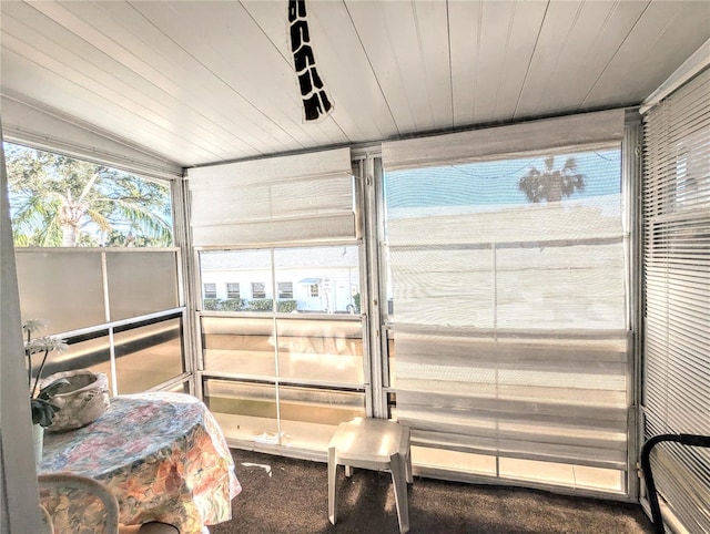 sunroom featuring wood ceiling