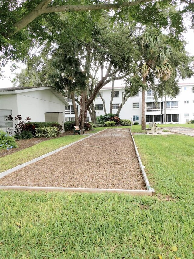 view of property's community with a yard