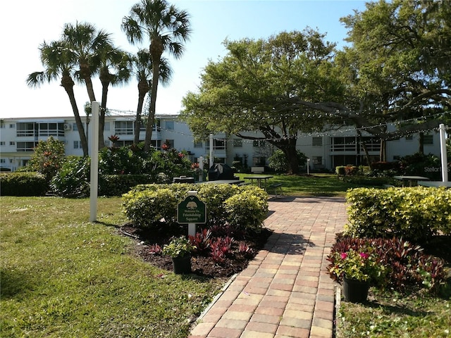 view of community featuring a lawn