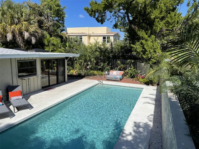 view of swimming pool with a patio area